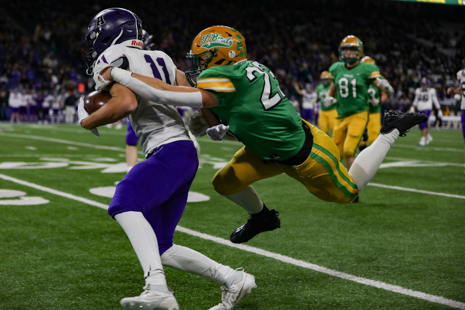 Tumwater's Peyton Davis dives for a tackle during a 60-30 loss to Anacortes Dec. 2. at Husky Stadium.
